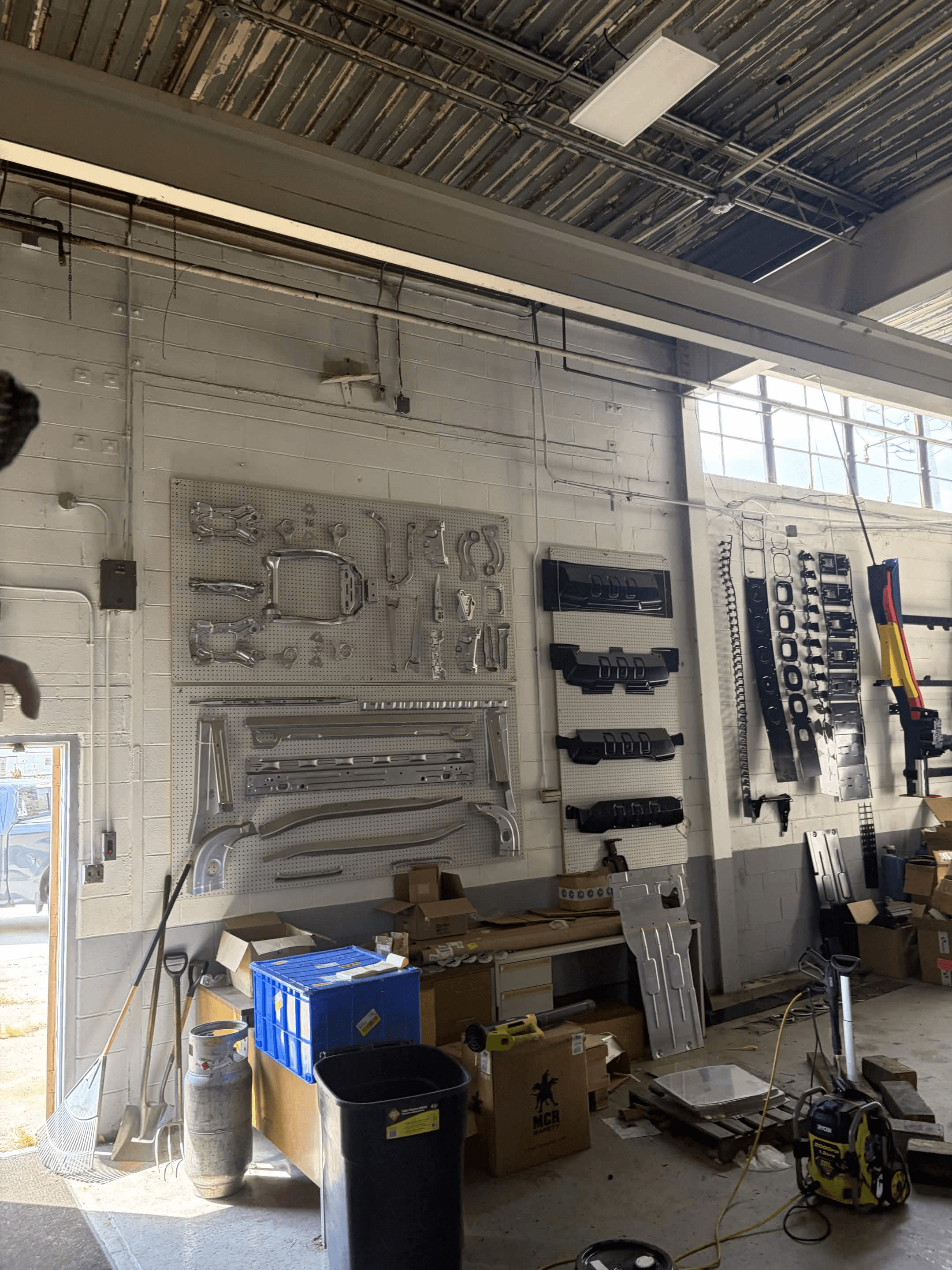 Manufactured automotive components displayed in a Michigan workshop